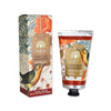 Hand cream with decorative packaging featuring birds and floral designs on a white background