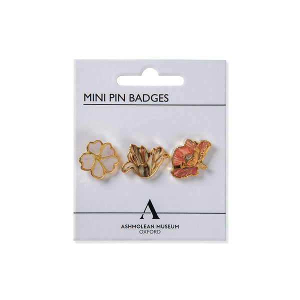 Packaged mini pin badges with floral designs on a white background, featuring the Ashmolean Museum logo.