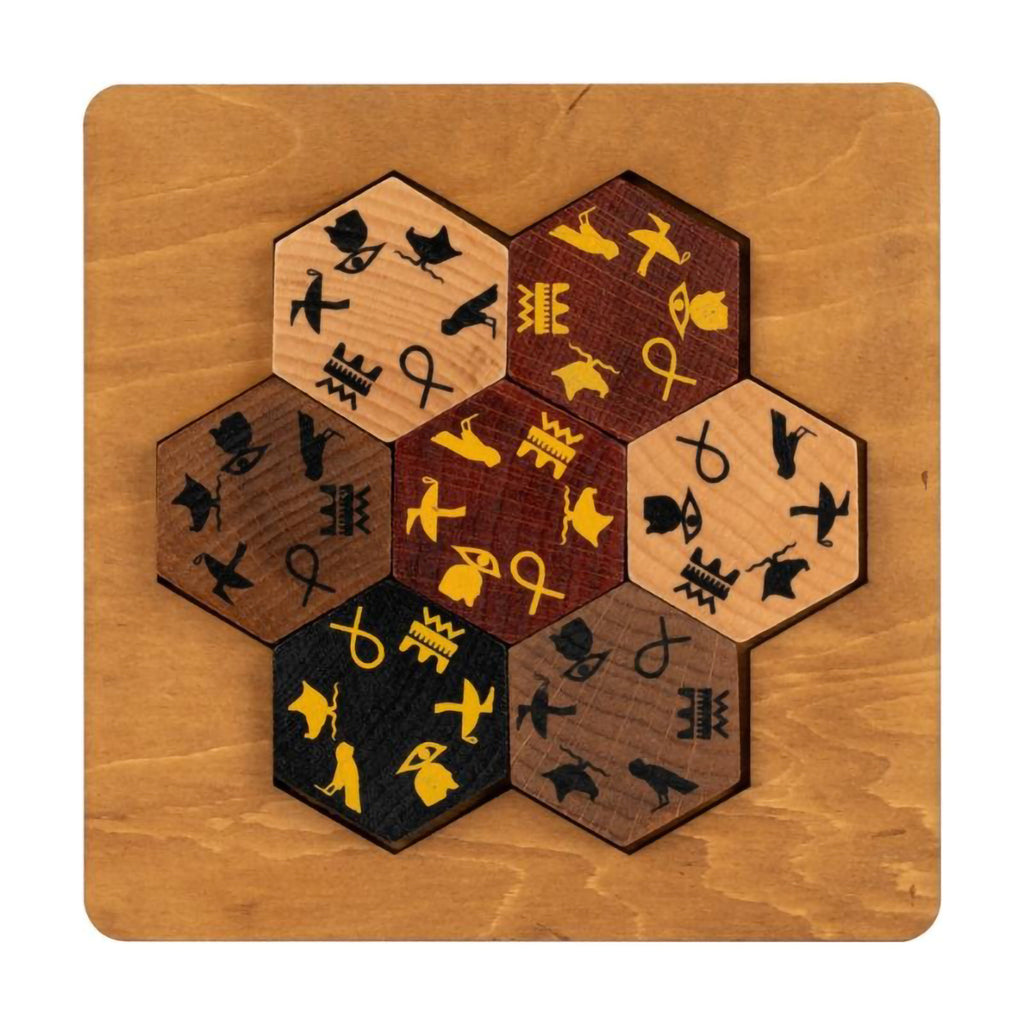 Hexagonal wooden puzzle with hieroglyph symbols on a wooden base