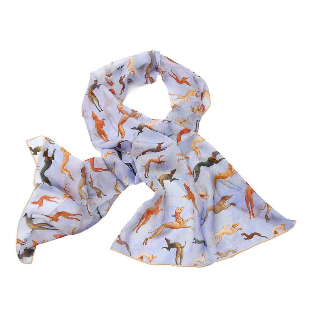 A chiffon silk scarf with a pattern inspired by the painting 'Hunt in the Forest' by Paolo Uccello, featuring hunting dogs on a pale blue background.