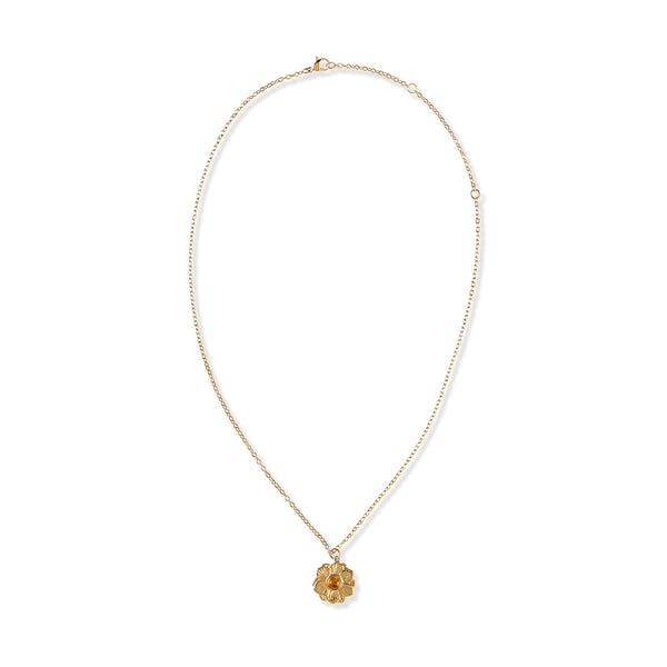 Gold necklace with a floral pendant on a white background