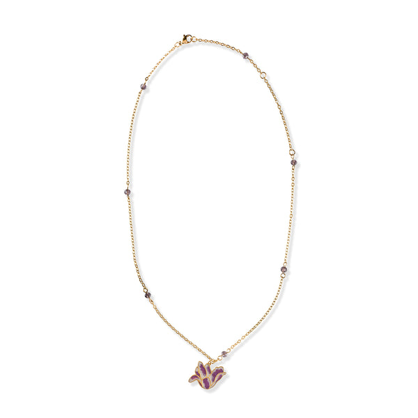 Gold tone necklace with purple gemstone beads and tulip flower shaped pendant in purple on a white background.