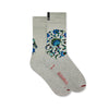Pair of cream and grey coloured cotton socks with floral pattern in the Iznik pottery style on a white background.
