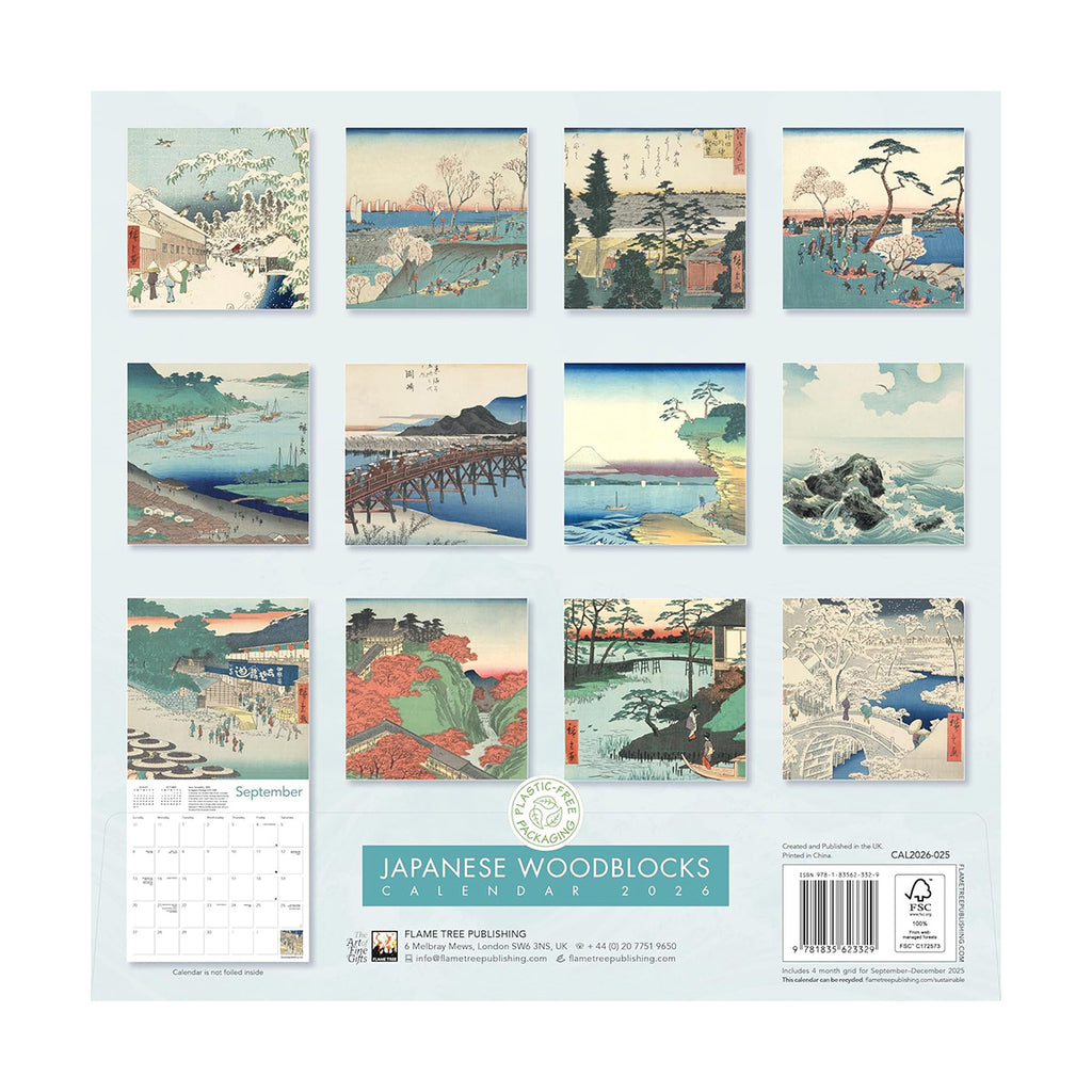 Blue sky with clouds and birds and waves crashing against boulders coming out fom the sea