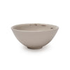 White porcelain dish with hints of black brushstroke design in interior.
