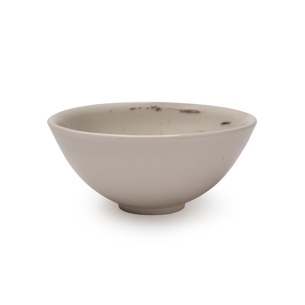 White porcelain dish with hints of black brushstroke design in interior.