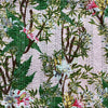 Patterned fabric with green leaves and pink flowers on a white background