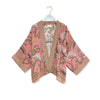 Pink and green floral design kimono with Indian kantha stitching design around edges and sleeves on a white background.
