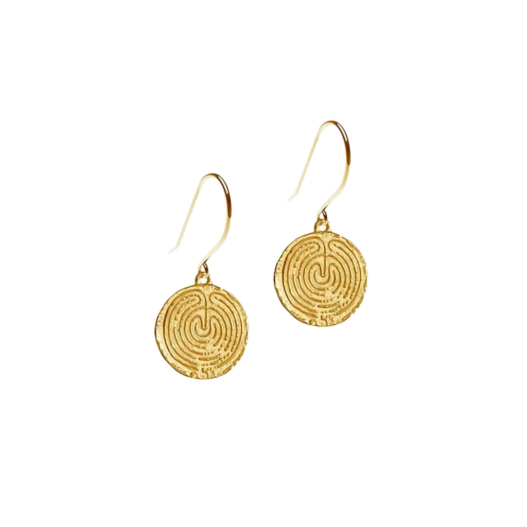 A pair of gold-coloured coin-shaped earrings with intricate labyrinth spiral patterns, suspended from gold hooks.