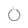 A bracelet with lapis lazuli blue beads and golden glass beads, featuring a gold plated sterling silver clasp.