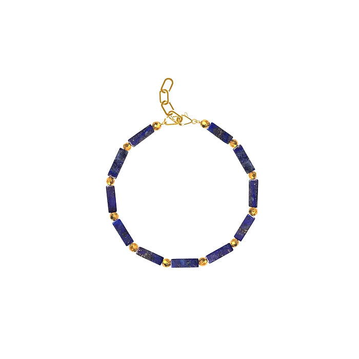 A bracelet with lapis lazuli blue beads and golden glass beads, featuring a gold plated sterling silver clasp.