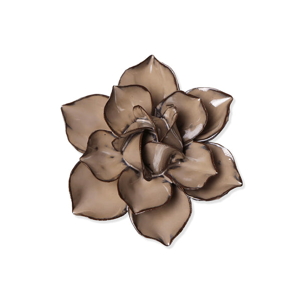Beige brown-coloured flower-shaped decorative item on a white background