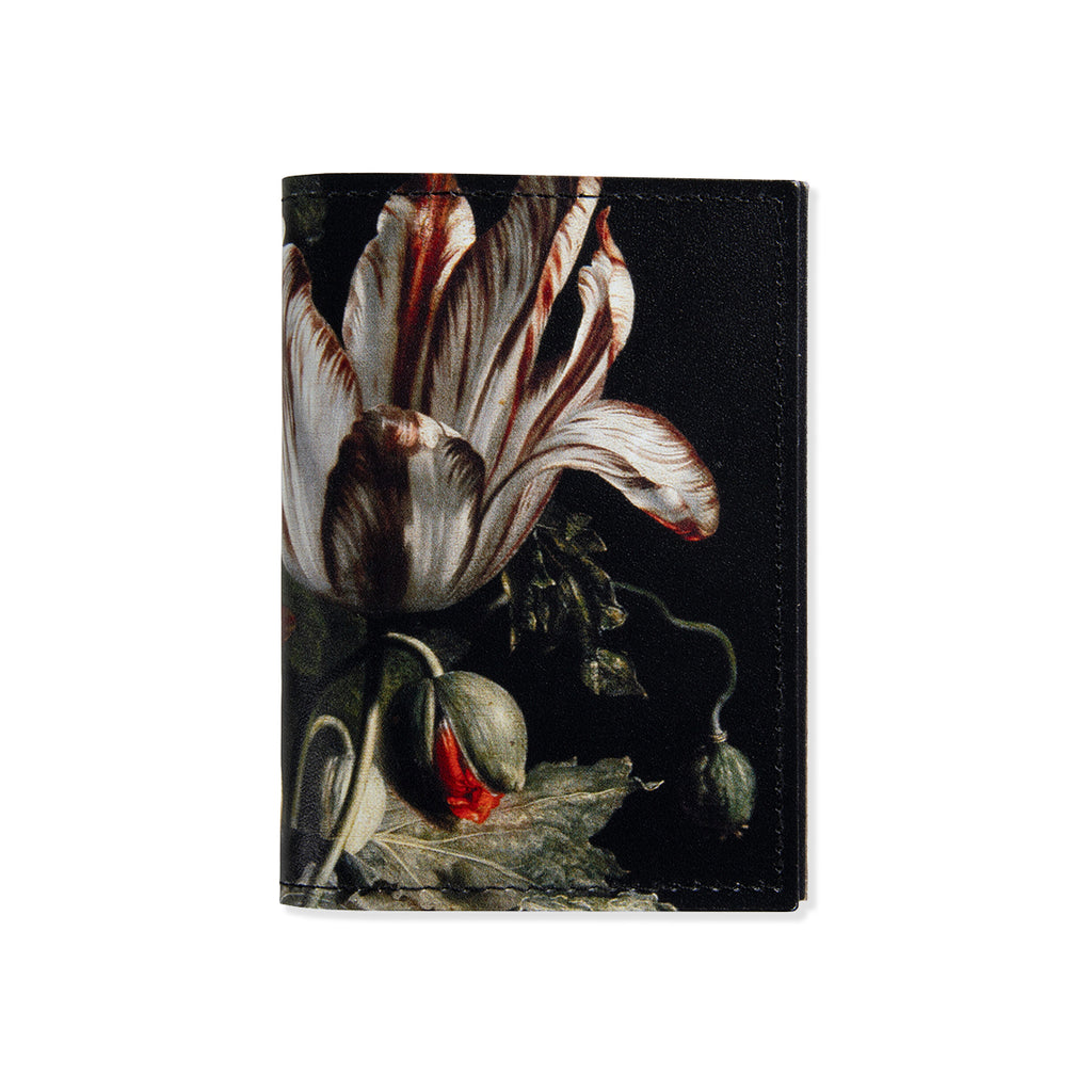 Leather wallet with floral design on a black background