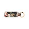 Floral leather keychain with Ashmolean Museum logo on a white background