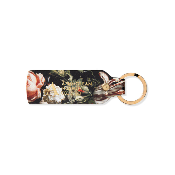 Floral leather keychain with Ashmolean Museum logo on a white background