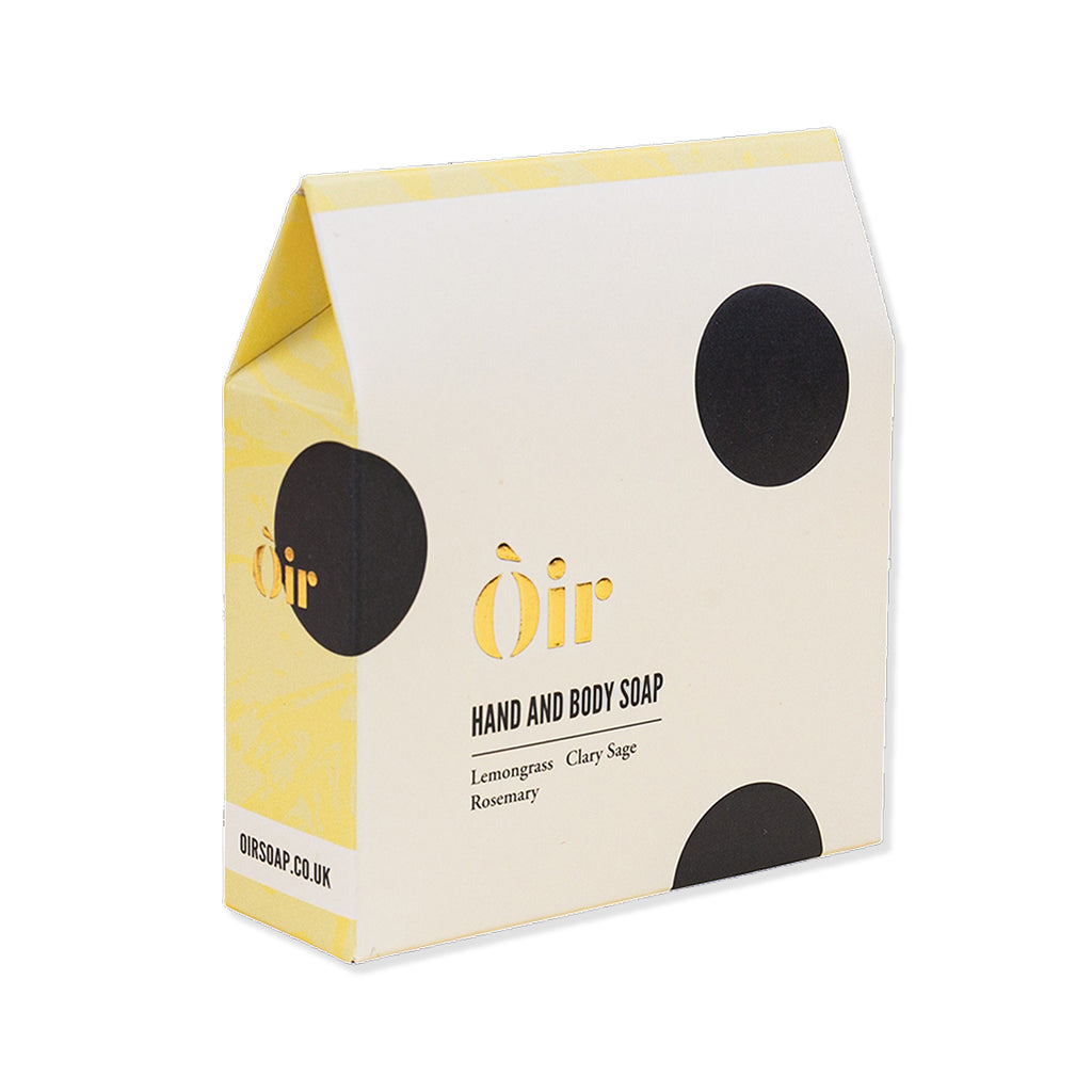 Box of Òir hand and body soap with black dots on a white background