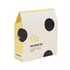 Box of Òir hand and body soap with black dots on a white background