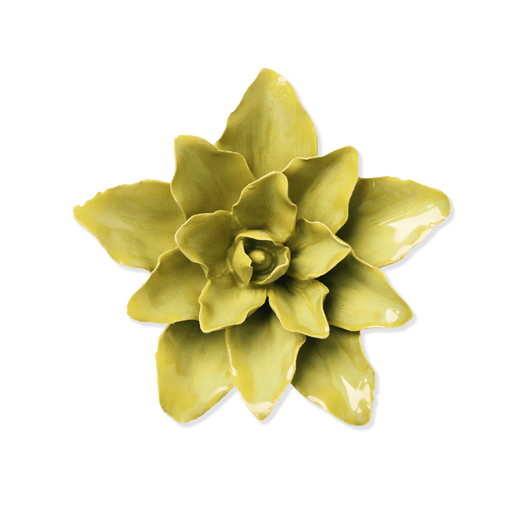 Green ceramic flower on a white background