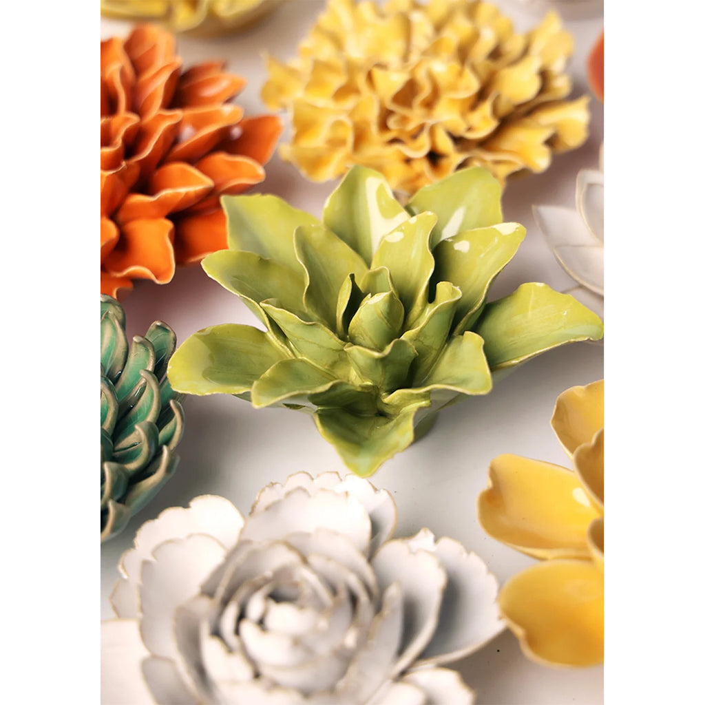 Colourful ceramic flowers on a white background