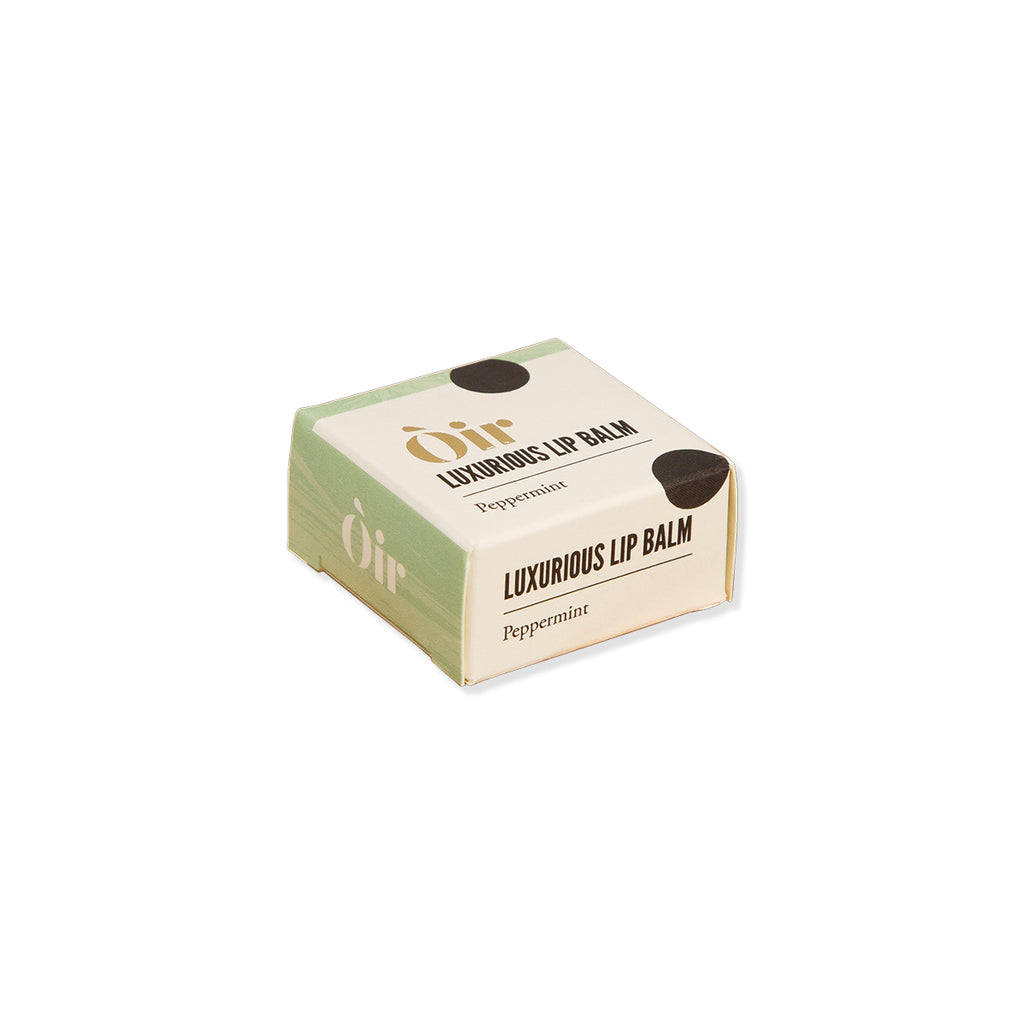 Box of Oir luxurious lip balm on a white background
