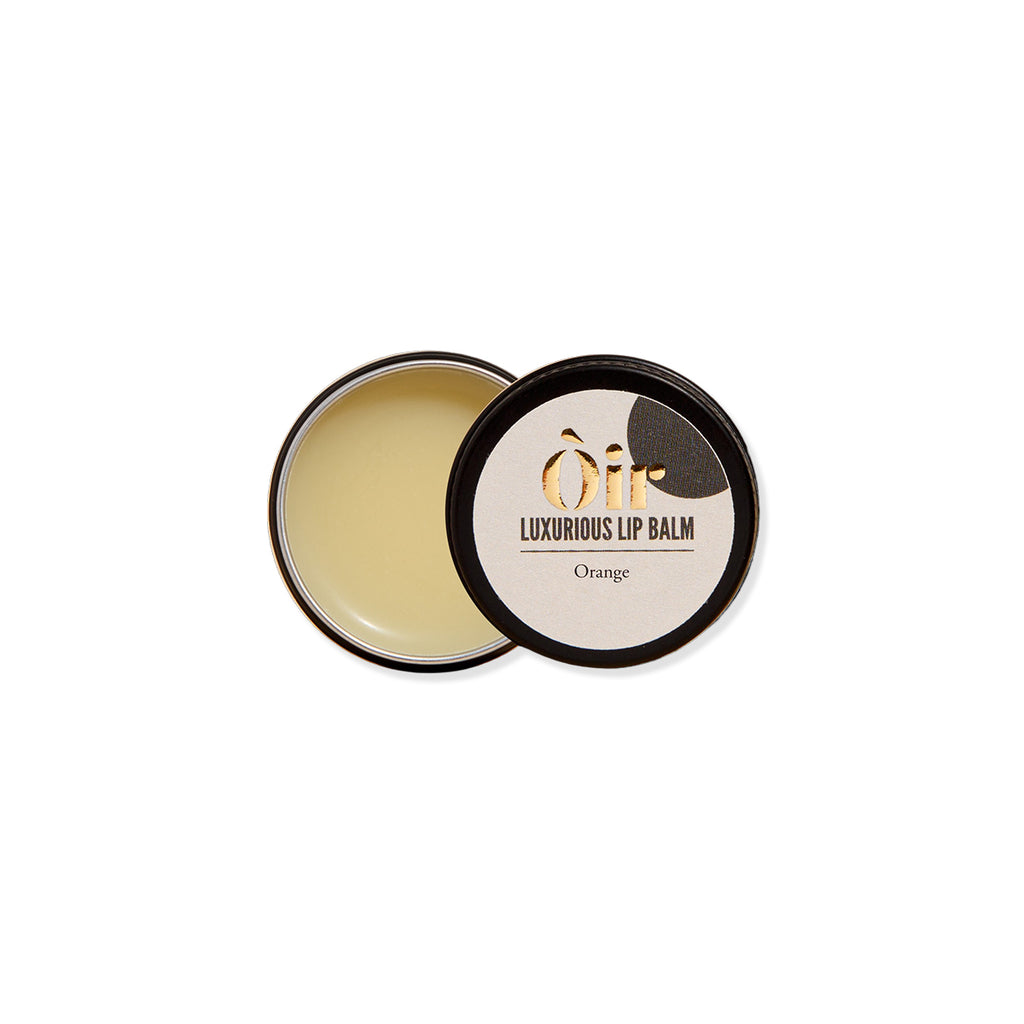 Luxurious lip balm with a black lid on a white background