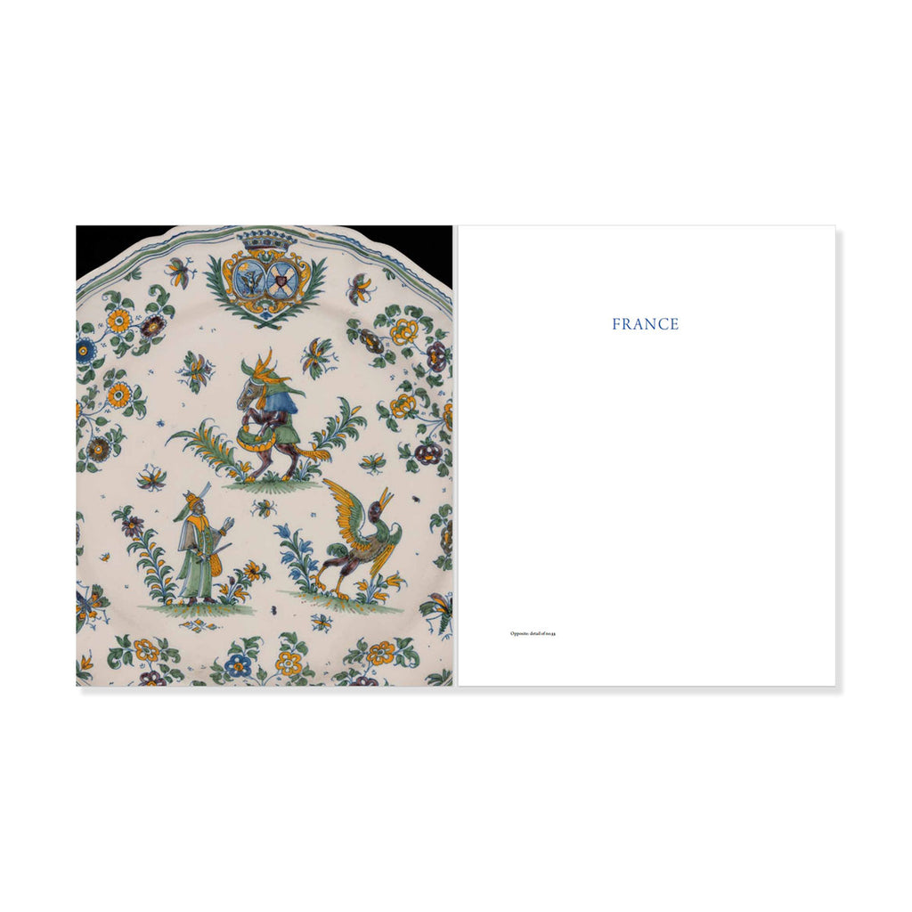 Decorative plate from France with floral and human-like figures and 'FRANCE' on a white background