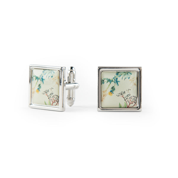 Square cufflinks with floral May Morris design on a white background