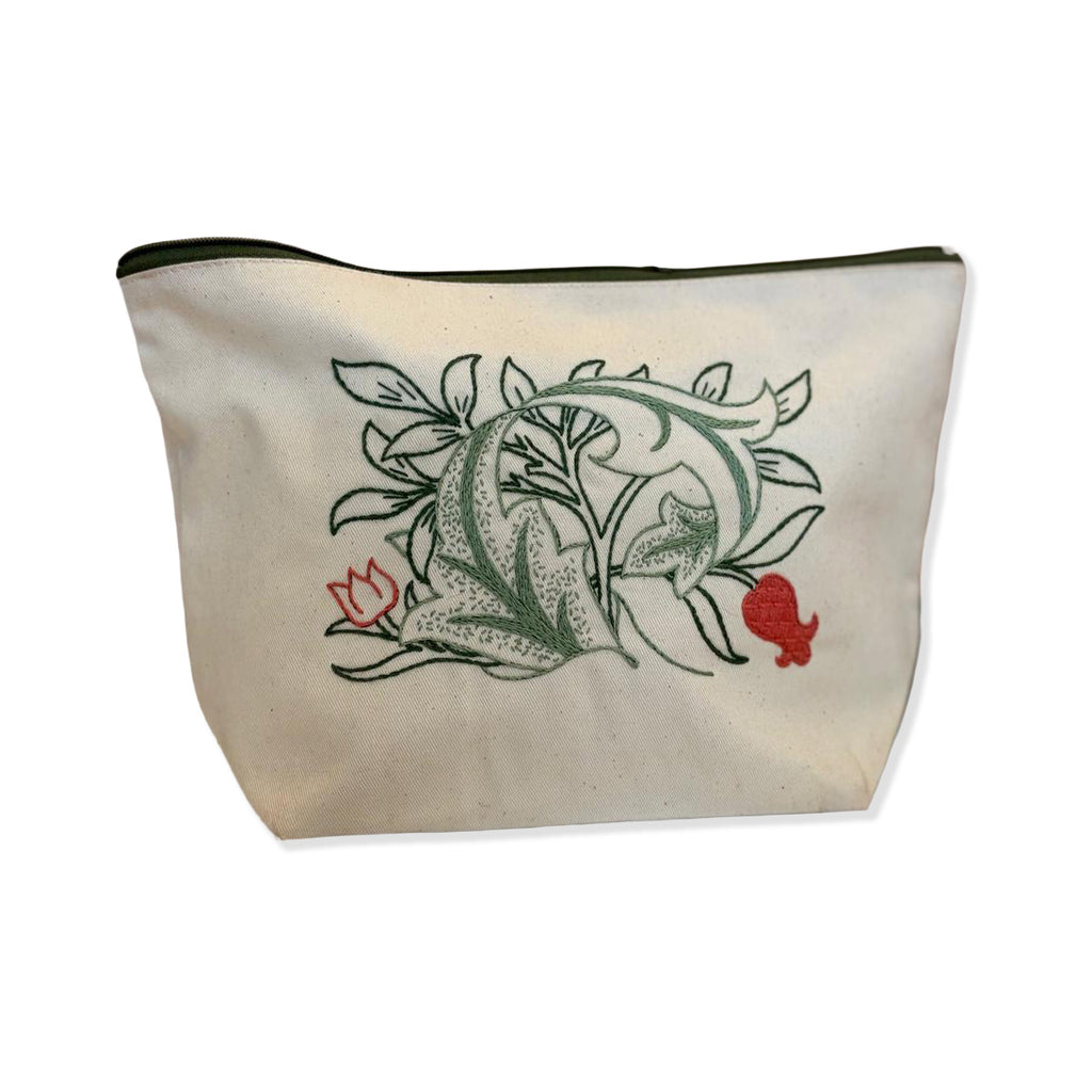 Canvas pouch with a green and red flowers design on a white background.