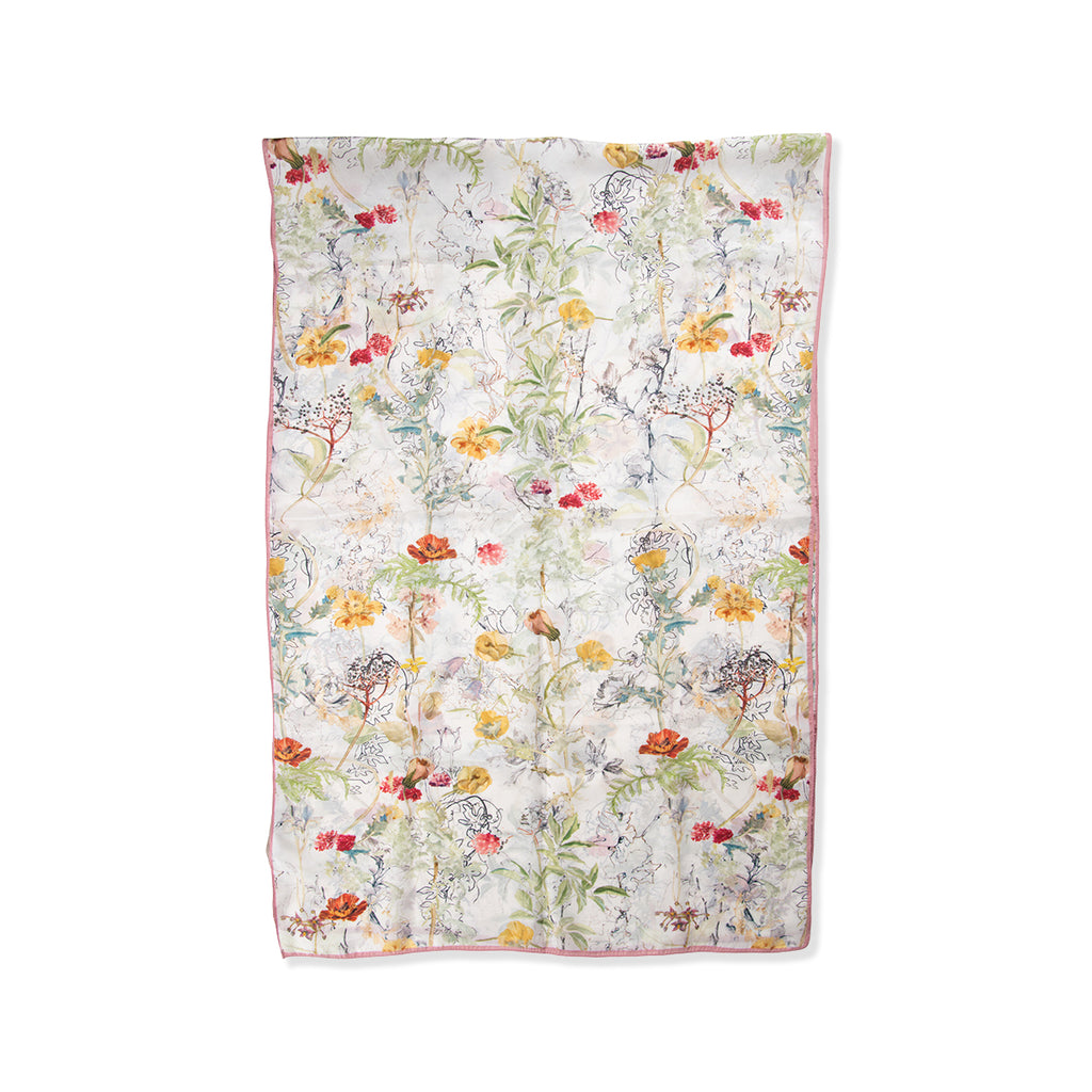 Floral patterned silk scarf on a white background