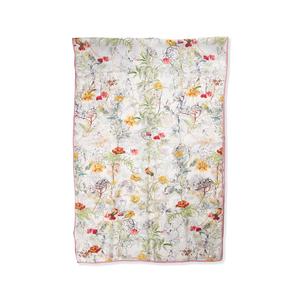 Floral patterned silk scarf on a white background