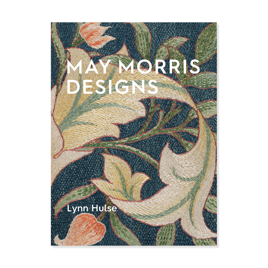 Book cover with floral design and 'May Morris Designs' text on a blue embroidered background