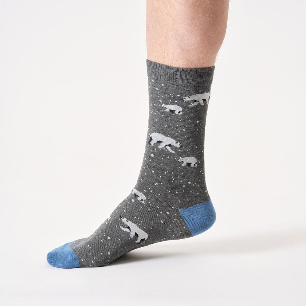 Gray sock with polar bear pattern and blue toe on a white background