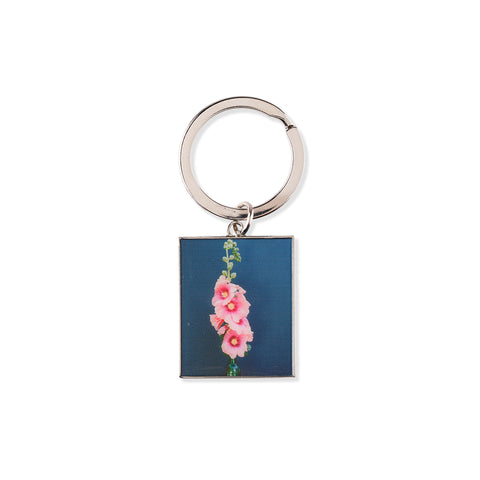 Keychain with floral design on a blue background