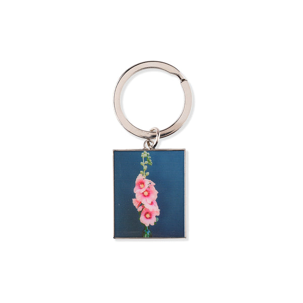 Keychain with floral design on a blue background