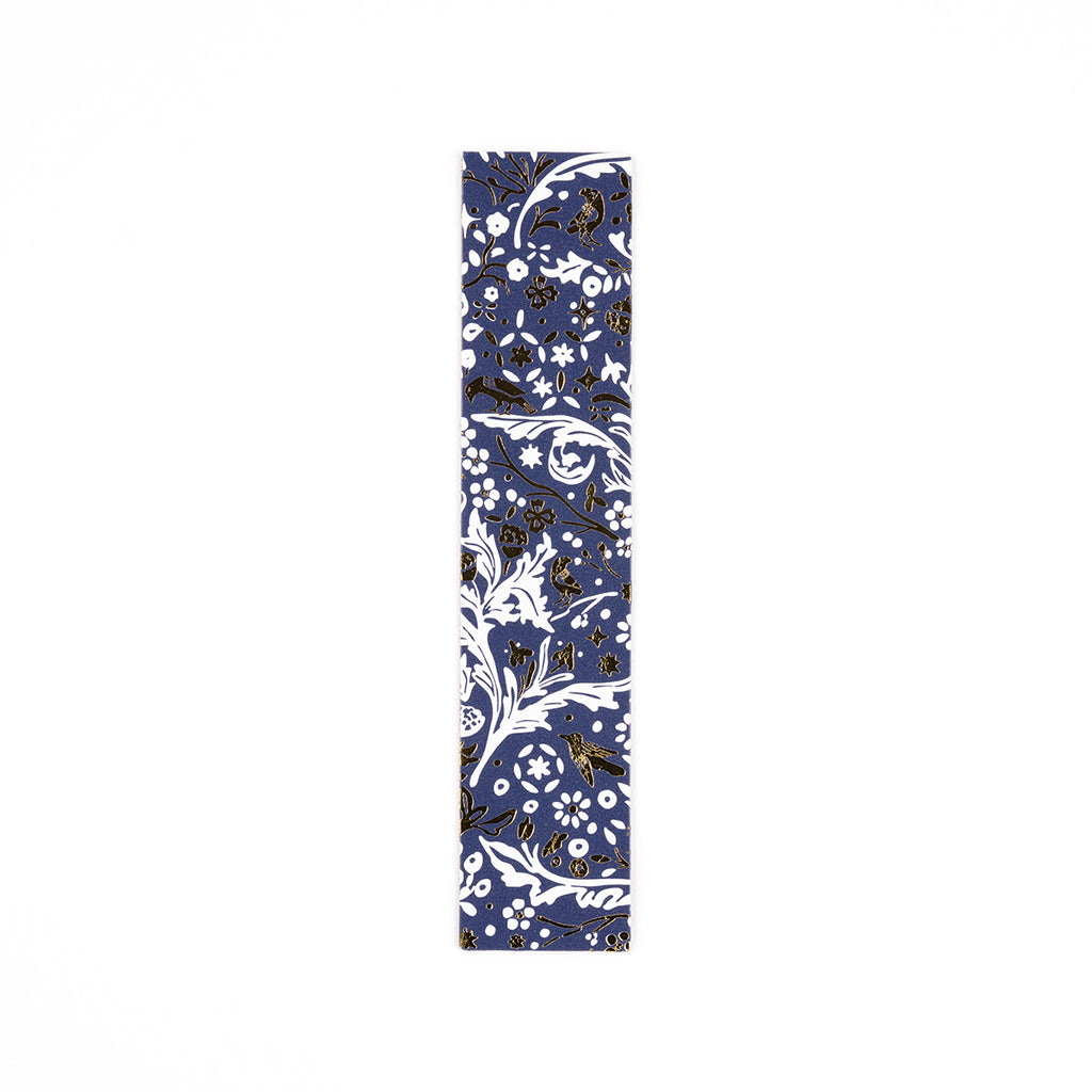 Blue, white and gold floral patterned leather bookmark on a white background