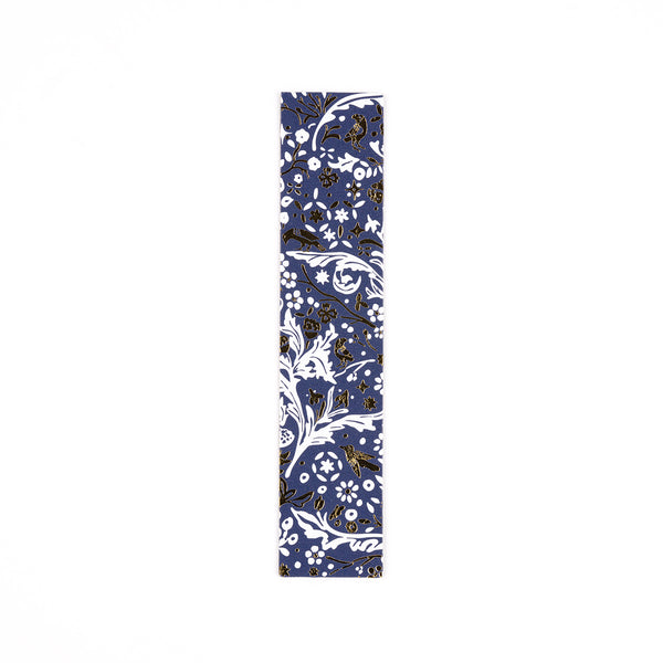 Blue, white and gold floral patterned leather bookmark on a white background
