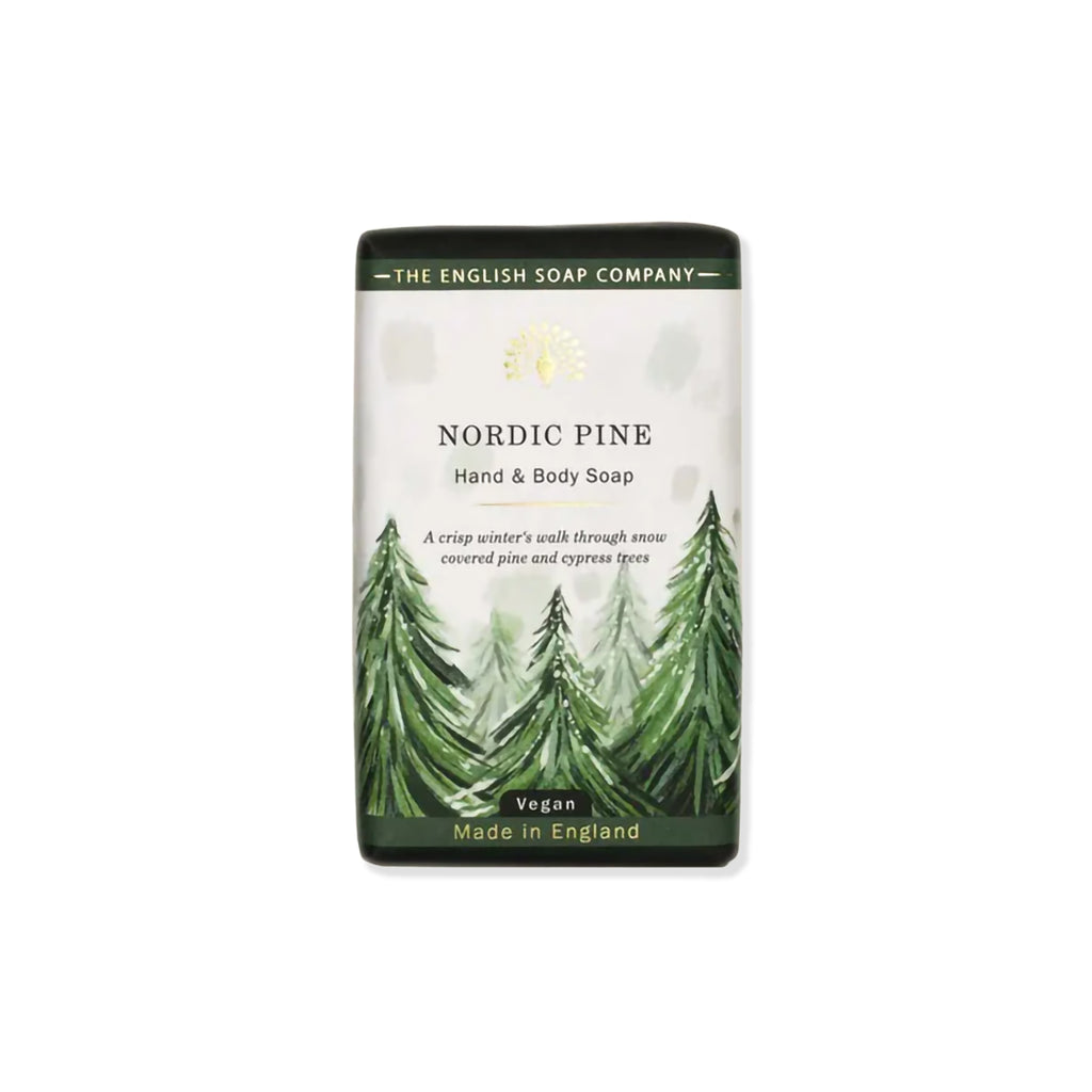 Bar of hand and body soap with Nordic Pine scent. Packaging features artwork of snowy trees and text 'VEGAN MADE IN ENGLAND' against a white background.