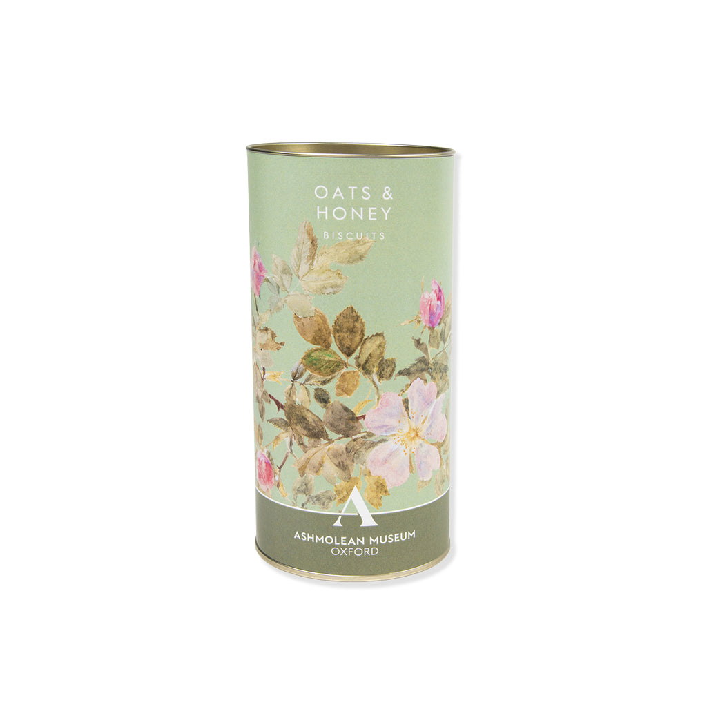 Oat honey biscuits with cylindrical product packaging with floral design and text on a white background
