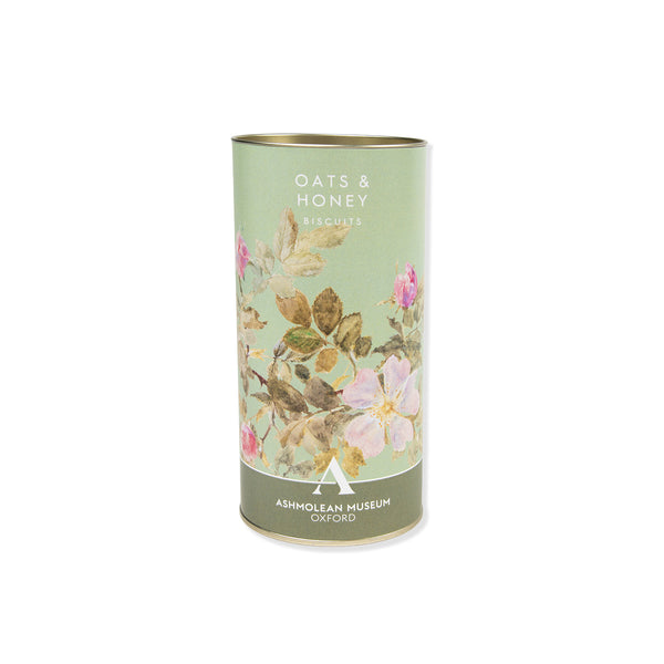Oat honey biscuits with cylindrical product packaging with floral design and text on a white background