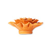 Orange ceramic flower-shaped object on a white background