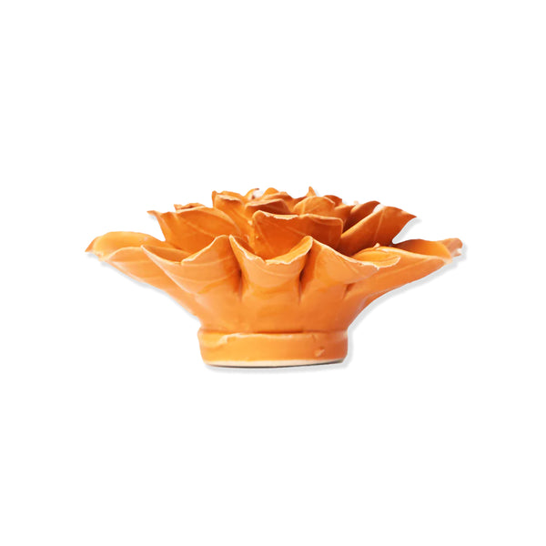 Orange ceramic flower-shaped object on a white background