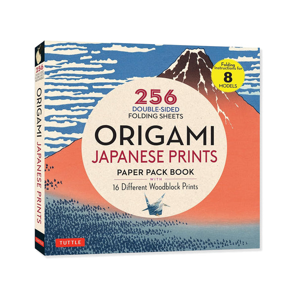 Origami Japanese Prints paper pack book by Tuttle, featuring a Japanese-style mountain and wave illustration on the cover with a large white oval center and red, black, and blue text.
