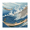 A square art print featuring a Japanese-style wave scene with blue ocean waves, white foam, a rocky shore, and two small boats with figures, shown against a light gray background.