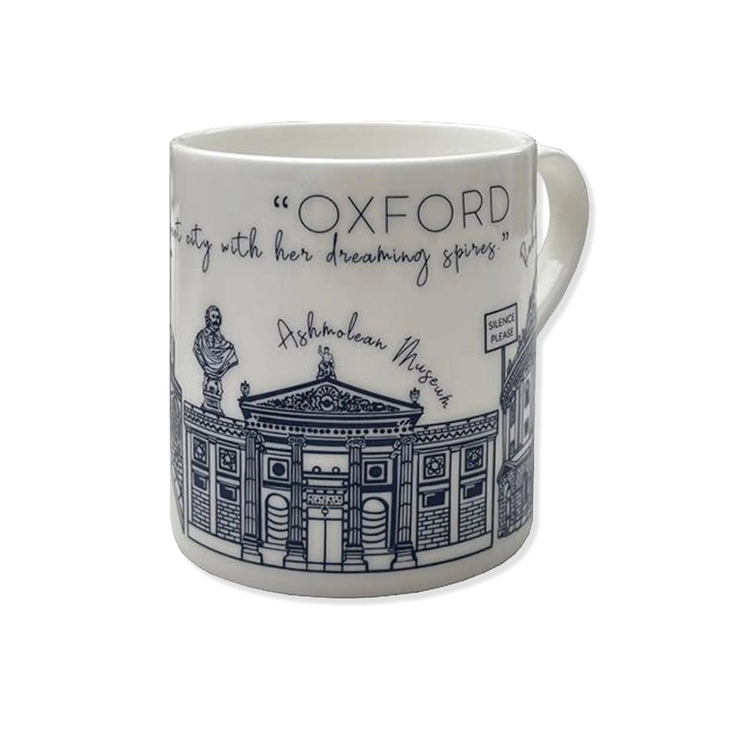 White china mug with blue building designs of Oxford University Ashmolean Museum and other landmark buildings.