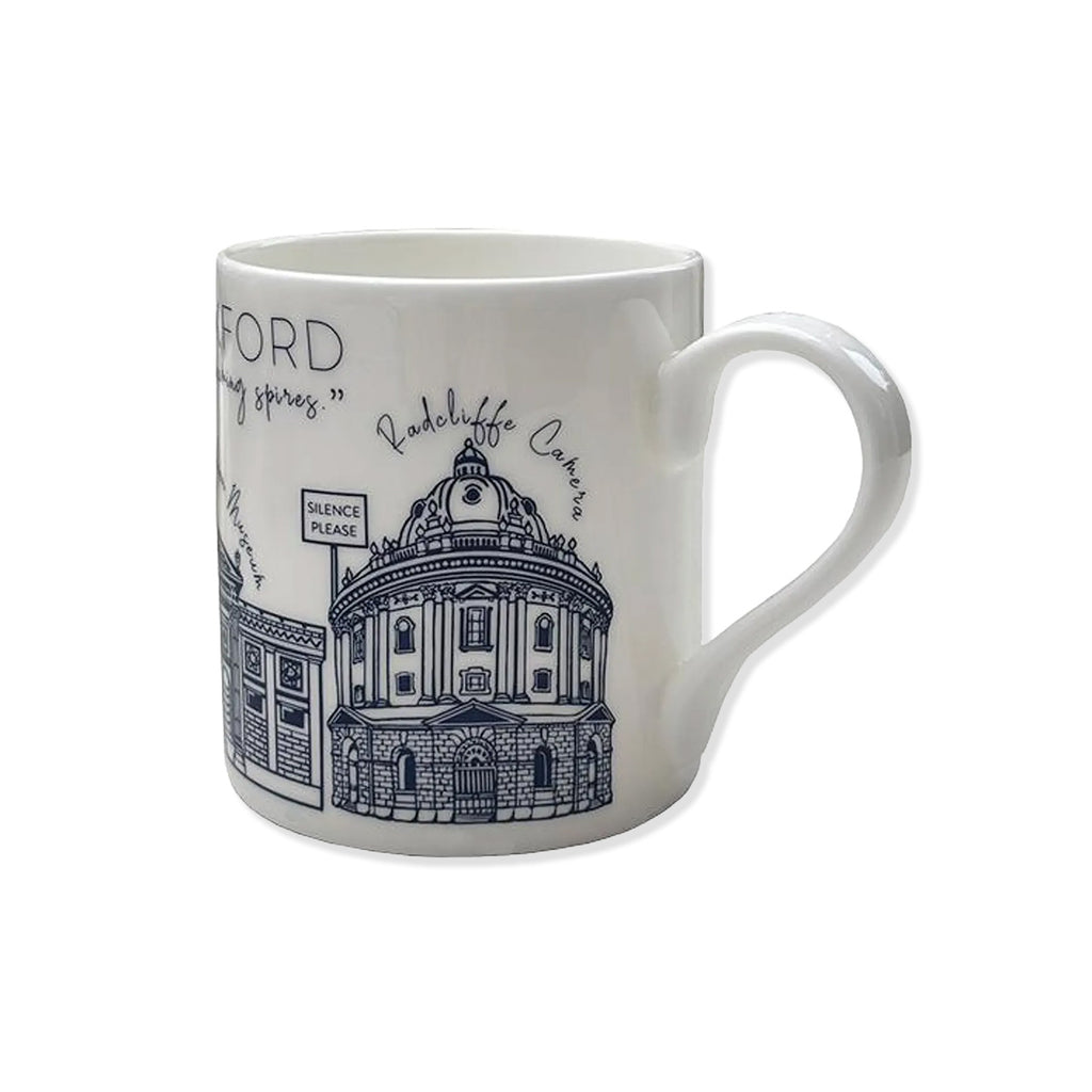 White china mug with blue building designs of Oxford University Radcliffe Camera and other landmark buildings.