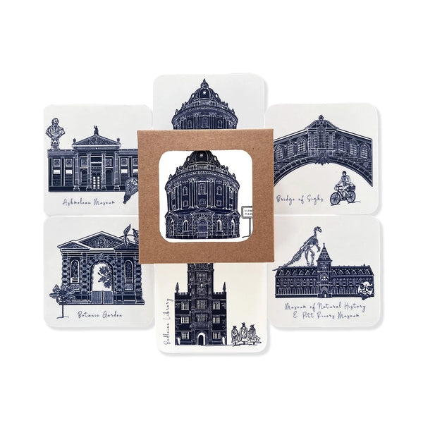 6 different drinks coasters with drawings of notable Oxford landmark buildings from the University in Blue and white.