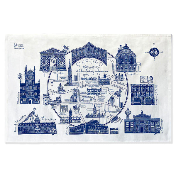 Tea towel with blue architectural illustrations of Oxford on a white background
