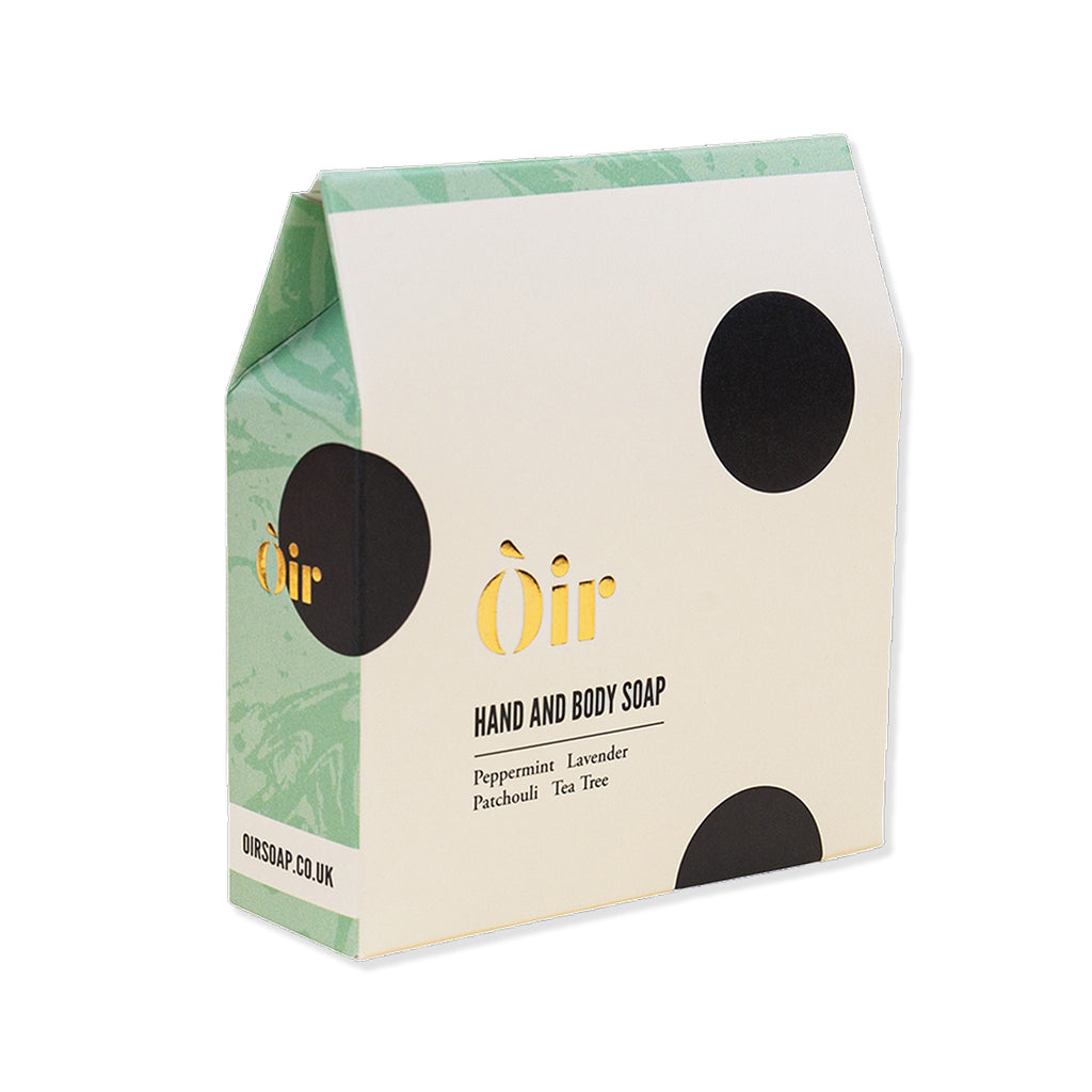 Box of Òir hand and body soap with green and beige design