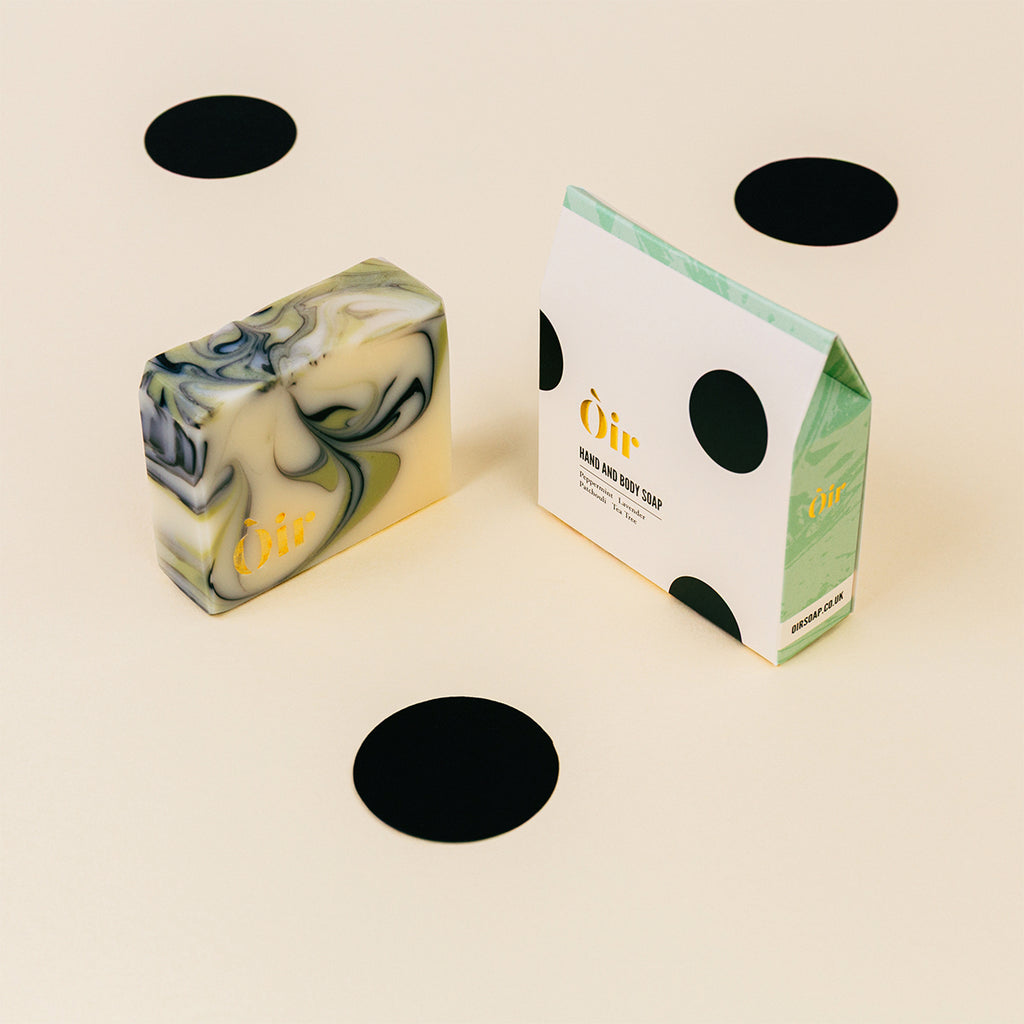 Oir hand and body soap with packaging on a white background