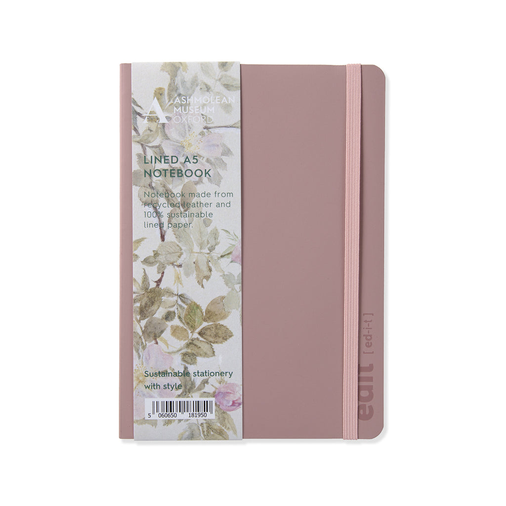 Pink leather notebook in A5 size with roses and flowers band on a white background. 